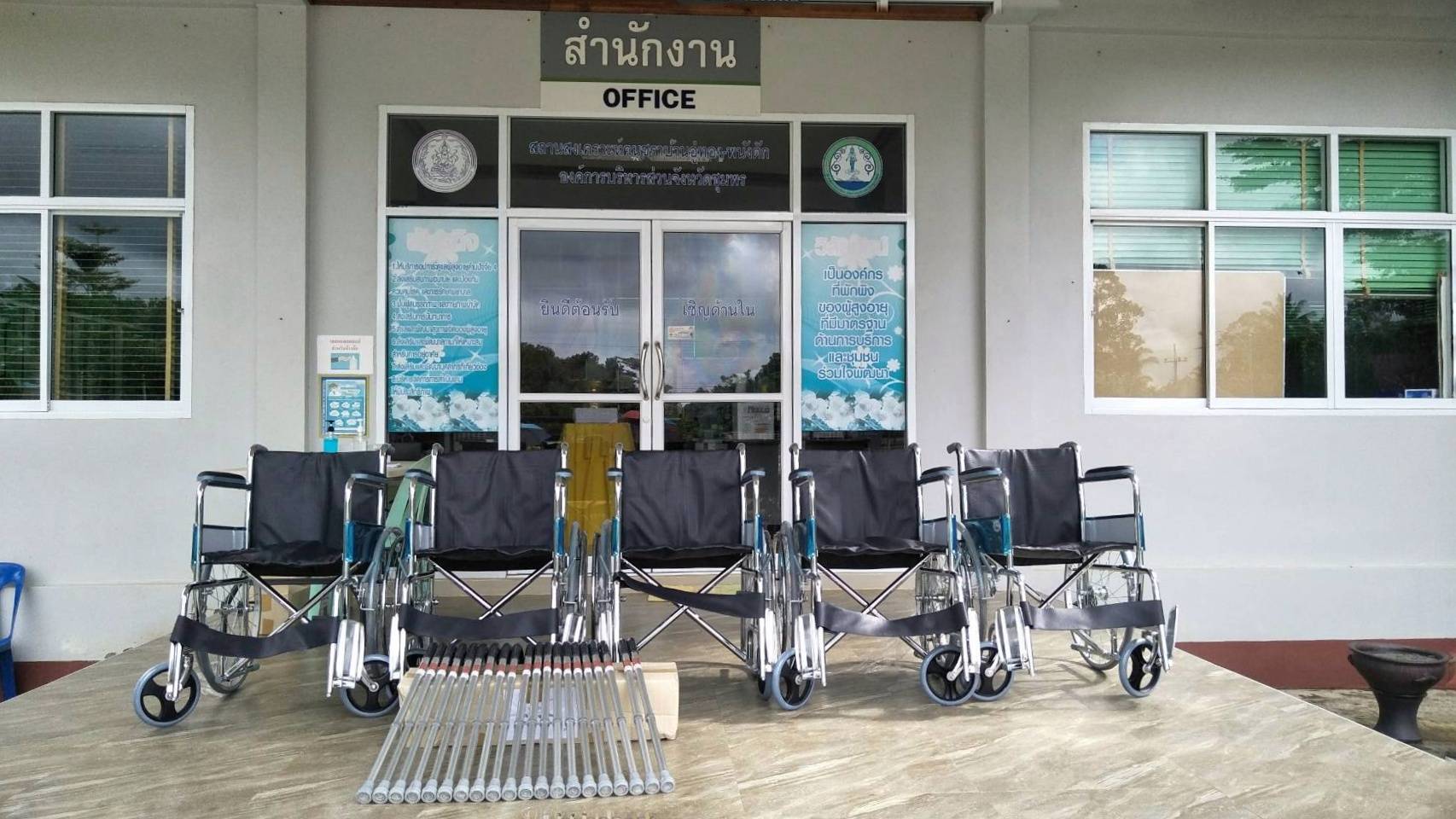 Chris Power Donated contributing wheelchairs and walking sticks to